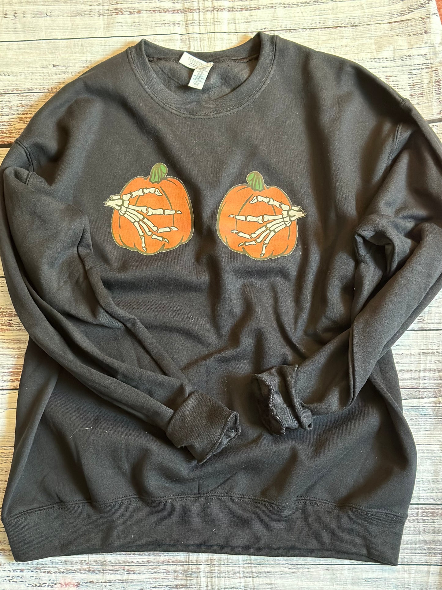 Pumpkins and skeleton hands