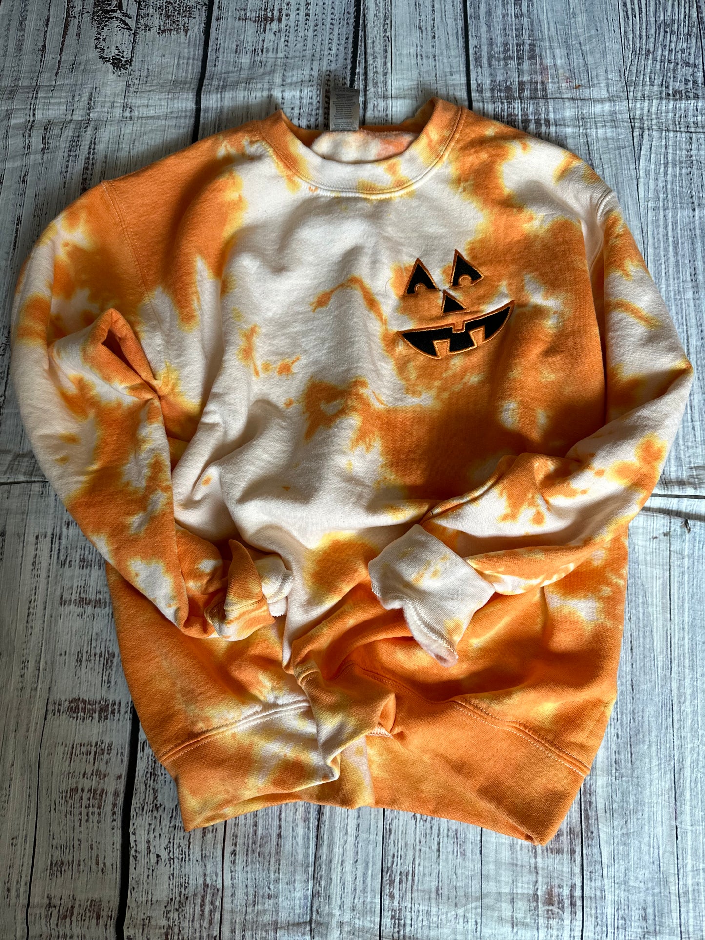 Orange acid wash Pumpkin embroidered face